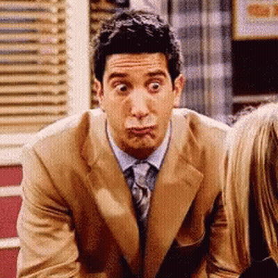 Man In Suit And Tie Making Funny Face GIF