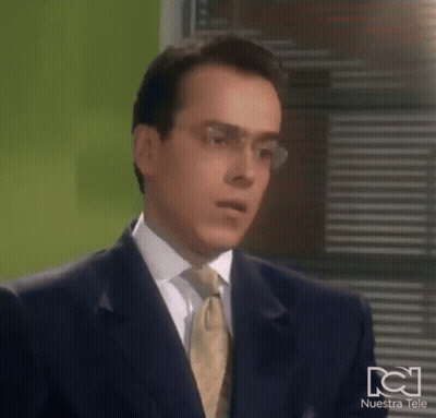 Man In Suit And Tie Making Funny Face With Glasses GIF