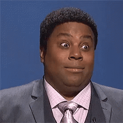 Man In Suit And Tie Making Funny Face GIF