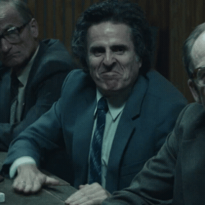 Man In Suit And Tie Making Funny Face GIF