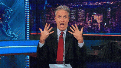 Man In Suit And Tie Making Shocked Face GIF