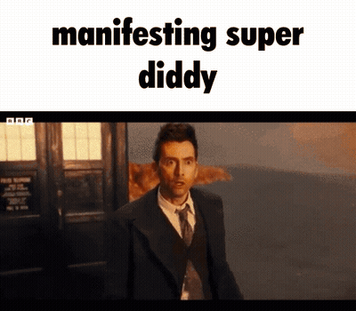 Man In Suit And Tie Manifesting Super Diddy GIF