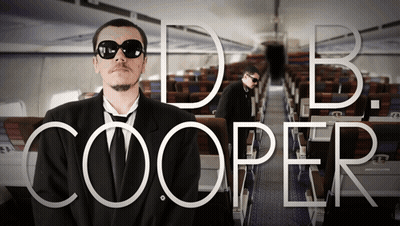 Man In Suit And Tie Named DB Cooper GIF