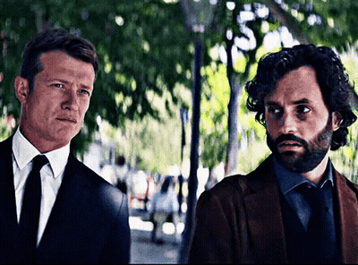 Man In Suit And Tie Next To Another Man GIF