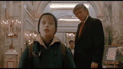 Man In Suit And Tie Next To Boy In Hat GIF