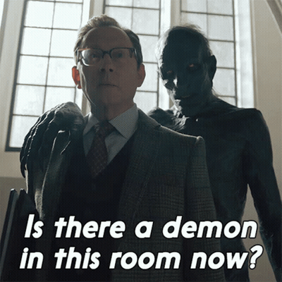 Man In Suit And Tie Next To Demon GIF