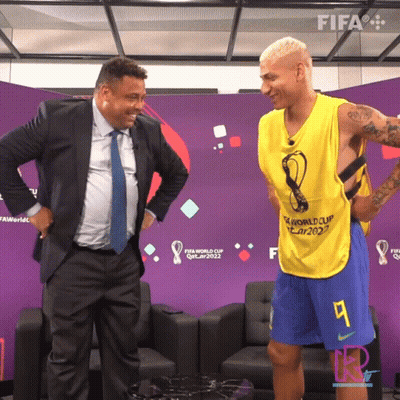 Man In Suit And Tie Next To FIFA World Cup Qatar 2022 Vest GIF