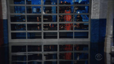 Man In Suit And Tie Next To Is Potato Sign GIF