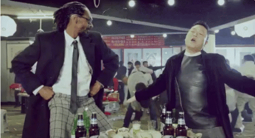 Man In Suit And Tie Next To Man In Black Jacket GIF