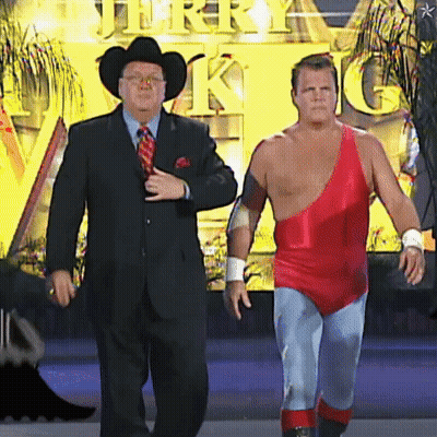 Man In Suit And Tie Next To Man In Red One Piece GIF