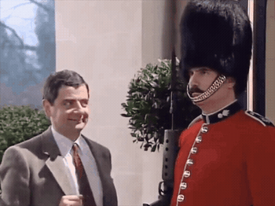 Man In Suit And Tie Next To Military Man GIF