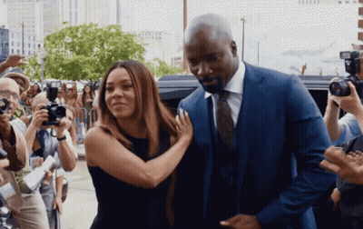 Man In Suit And Tie Next To Woman GIF