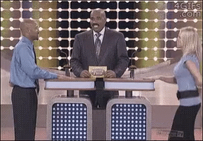 Man In Suit And Tie Next To Woman In Blue GIF
