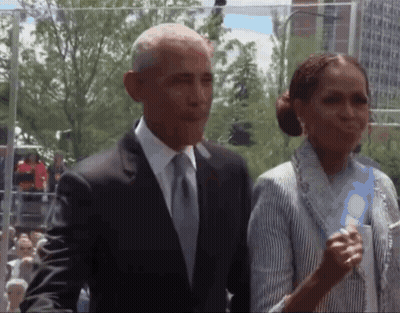 Man In Suit And Tie Next To Woman In Striped Shirt GIF