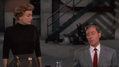 Man In Suit And Tie Next To Woman GIF