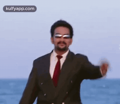 Man In Suit And Tie On Beach GIF