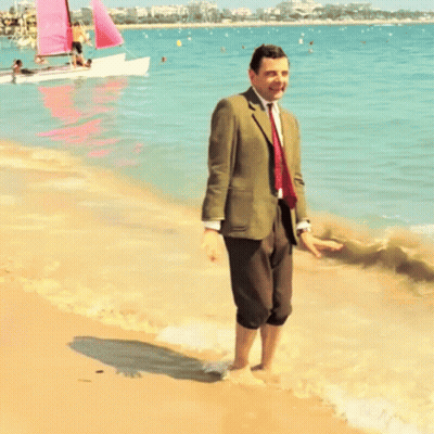 Man in Suit and Tie on Beach
