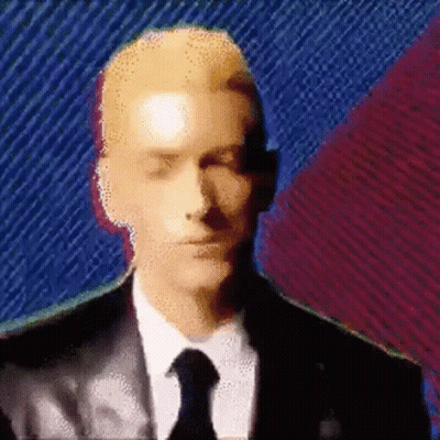 Man In Suit And Tie On Colorful Background GIF