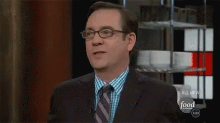 Man In Suit And Tie On Food Network GIF