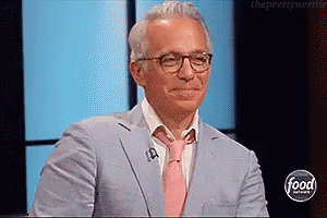 Man In Suit And Tie On Food Network GIF