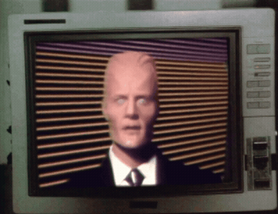 Man In Suit And Tie On Monitor GIF