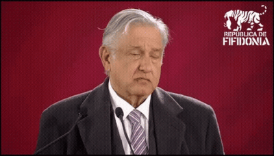 Man In Suit And Tie On Red Background Saying Republica De Fiidonia GIF