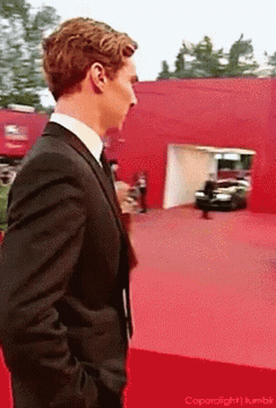 Man In Suit And Tie On Red Carpet GIF