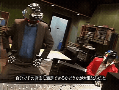 Man In Suit And Tie On Stage With Questions And Answering Sign GIF