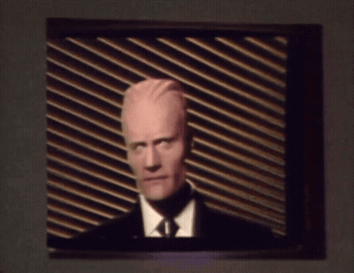 Man In Suit And Tie On TV GIF