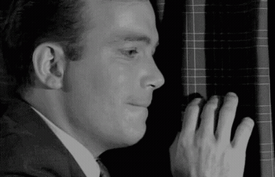 Man In Suit And Tie Peeking Behind Window GIF