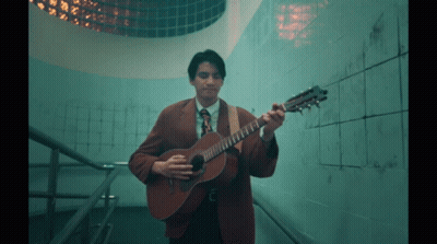 Man In Suit And Tie Playing Guitar GIF