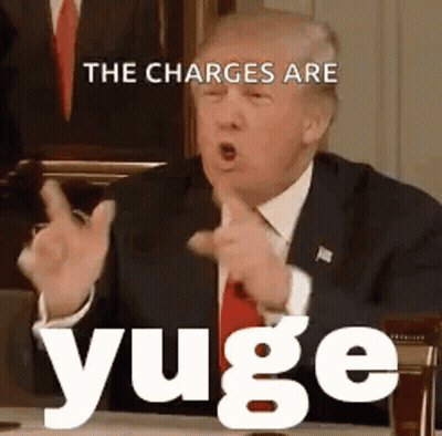 Man In Suit And Tie Pointing At Desk GIF