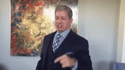 Man In Suit And Tie Pointing GIF