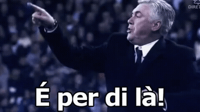 Man In Suit And Tie Pointing Saying E Per Di La GIF