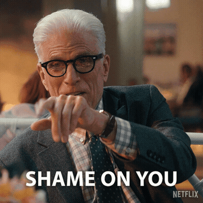 Man in Suit and Tie Pointing Shame on You