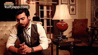 Man In Suit And Tie Praying GIF