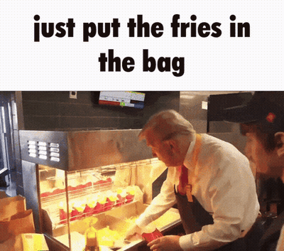 Man In Suit And Tie Putting French Fries Into Bag GIF