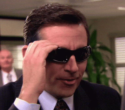 Man In Suit And Tie Putting On Sunglasses GIF