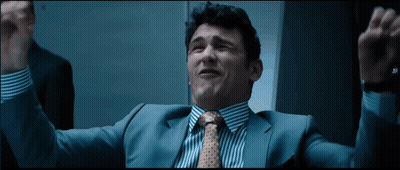 Man In Suit And Tie Raising Arms GIF