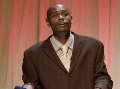 Man In Suit And Tie Red Curtain GIF