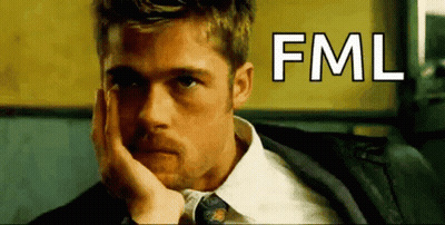 Man In Suit And Tie Resting Head On Hand Saying FML GIF