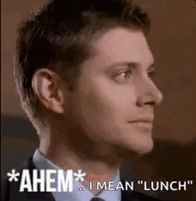 Man In Suit And Tie Saying Ahem GIF