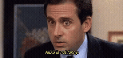Man In Suit And Tie Saying AIDS Is Not Funny GIF