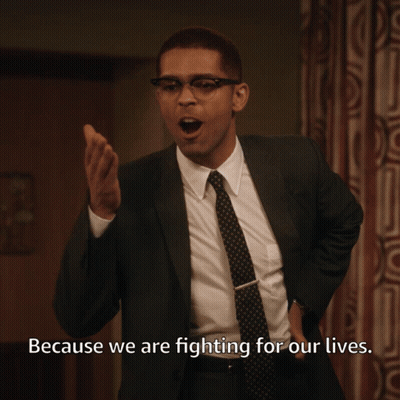 Man in Suit and Tie Saying Because We Are Fighting for Our Lives