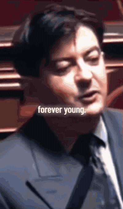 Man In Suit And Tie Saying Forever Young GIF