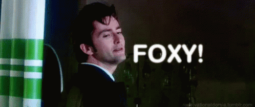 Man In Suit And Tie Saying Foxy GIF
