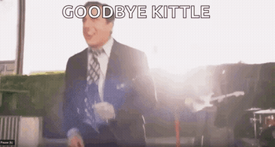 Man in Suit and Tie Saying Goodbye Kittle in Front of Guitar