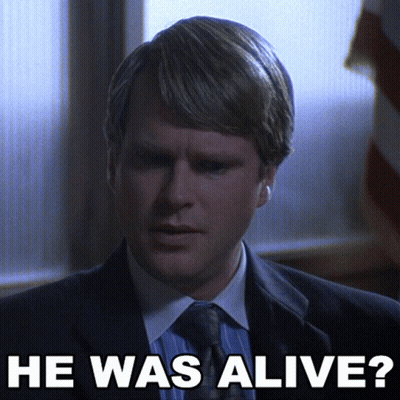 Man In Suit And Tie Saying He Was Alive GIF