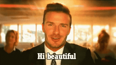 Man In Suit And Tie Saying Hi Beautiful GIF