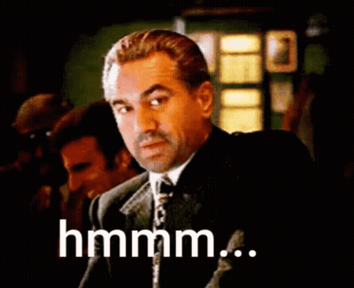 Man In Suit And Tie Saying Hmm GIF